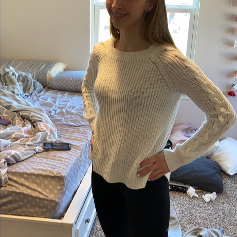 A white sweater, lightly warn.